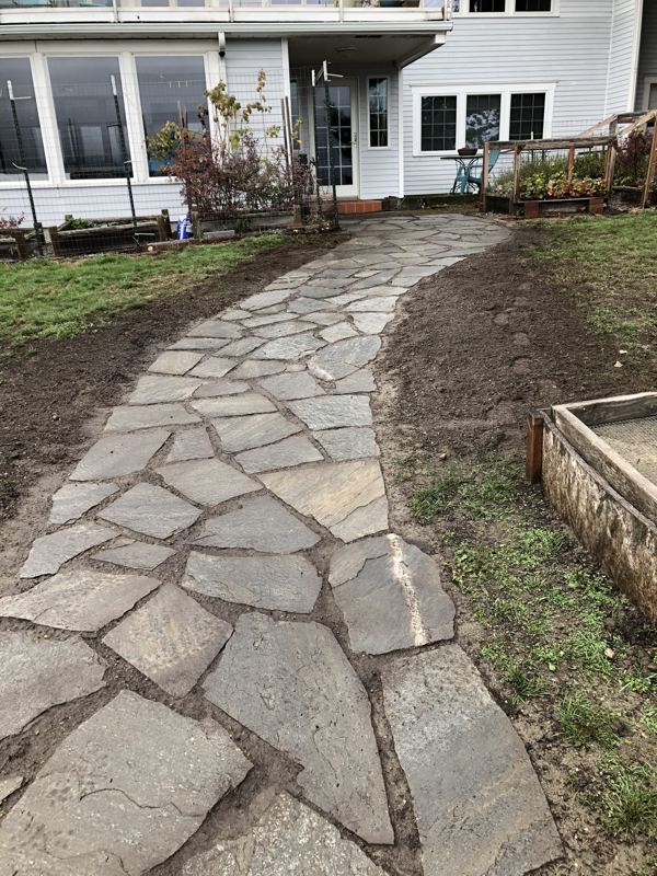 New flagstone walkway leading up to a home